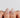 Nude nail designs on almond press-on nails with hand-painted white floral accents by Joyee Nails