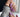 Lavender chrome almond press-on nails with iridescent shimmer finish — the trending purple nail design for 2026, paired with gold jewelry and cozy knit for a soft luxury look.