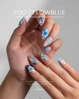 Bali Blue short almond press-ons with water ripple texture and sculpted blue flowers