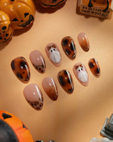 Leopard Boo press on nails with ghosts wearing leopard bows, amber tortoiseshell with gold chrome and leopard print French tips - image 1
