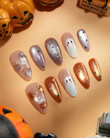 Twilight Pumpkin press on nails with chrome pumpkins, pastel ghosts and gold stars on lavender and copper cat eye - image 1