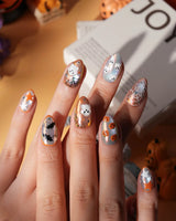 Candy Bucket press on nails with a 3D jack-o'-lantern, puffy 3D ghosts, bats and silver stars on an aurora finish with orange edges - image 1