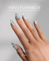 Dead Sea Blue seafoam green press-on nails with sculpted shells, pearls, and jelly gloss
