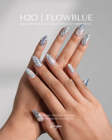 Great Barrier Blue luxurious ocean nails with silver-blue tones and sculpted shell details