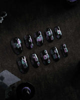 Party Spirits press on nails with holographic teal, lilac and pink glitter ghosts on a glossy black base - image 2