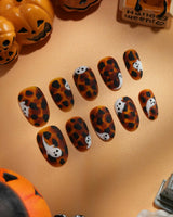 Peek-a-Boo press on nails with little white ghosts peeking out on a matte amber tortoiseshell base - image 2