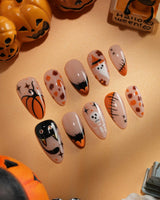 Monster Mash handmade Halloween press on nails with orange pumpkin, vampire, skeleton, stitches and bats on a sheer nude base - image 2
