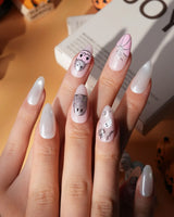 Pinkoween pink Halloween press on nails with pink pumpkins, a glitter ghost, silver bats and moons and holographic silver glitter nails - image 3