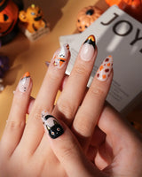 Monster Mash handmade Halloween press on nails with orange pumpkin, vampire, skeleton, stitches and bats on a sheer nude base - image 3
