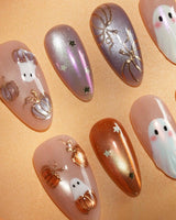 Twilight Pumpkin press on nails with chrome pumpkins, pastel ghosts and gold stars on lavender and copper cat eye - image 3
