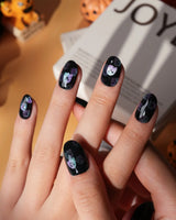Party Spirits press on nails with holographic teal, lilac and pink glitter ghosts on a glossy black base - image 3