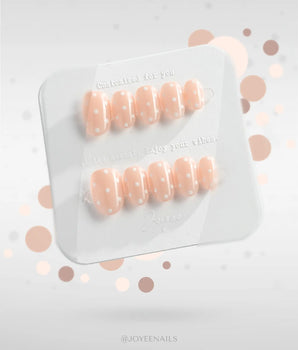 Cloud Cream-Mini handmade press-on nails featuring Peach Nude, Sweet White Polka Dots.