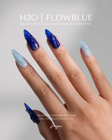Majorelle Blue editorial nails with bold Moroccan blue, dusty blue, and 3D pearl details