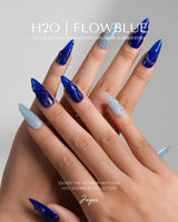 Majorelle Blue medium stiletto nails with vibrant blue swirls, icy sky blue, and high-gloss shine