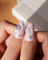 Pinkoween pink Halloween press on nails with pink pumpkins, a glitter ghost, silver bats and moons and holographic silver glitter nails - image 4