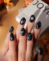 Party Spirits press on nails with holographic teal, lilac and pink glitter ghosts on a glossy black base - image 4