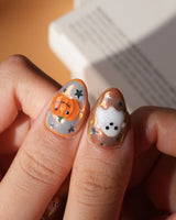 Candy Bucket press on nails with a 3D jack-o'-lantern, puffy 3D ghosts, bats and silver stars on an aurora finish with orange edges - image 5