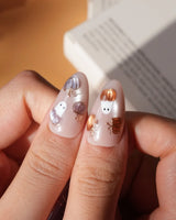 Twilight Pumpkin press on nails with chrome pumpkins, pastel ghosts and gold stars on lavender and copper cat eye - image 5