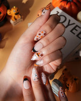 Monster Mash handmade Halloween press on nails with orange pumpkin, vampire, skeleton, stitches and bats on a sheer nude base - image 5