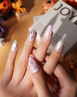 Pinkoween pink Halloween press on nails with pink pumpkins, a glitter ghost, silver bats and moons and holographic silver glitter nails - image 5