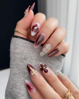 Tip Burgundy Nails with deep burgundy tips, milky white base, gold cross, and floral accents