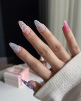 Charming Glam Usagi medium almond nails with charming character-inspired details and glossy finish