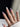Klein Blue Cherry medium almond press-on nails with white French tips and blue cherry art