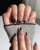 Close-up of Silver Sleek showing reflective chrome French tip detail