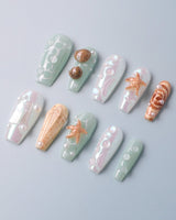 Mauritius Escape custom press-on nails with tropical shell accents and mint ocean shine
