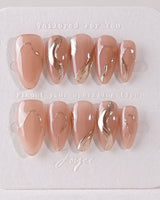 Poetic Glamour Nude press-on nails in short almond shape — nude french tip gold line