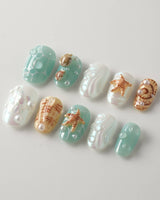 Mauritius Escape close-up of tropical shell nail art with pearls and water-drop shine