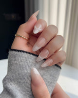 Dew Sparkle nude French tip press-ons with glossy gel finish and delicate pearl accents