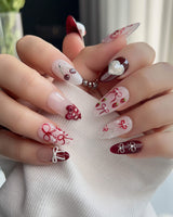 KT Cake press-on nails in M medium almond with playful dessert nail art and glossy gel finish