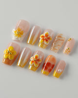 Caramel Bloom press-on nails in short coffin with warm caramel flower-inspired nail art