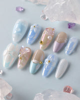 Aqua Petal close-up of glossy pastel blue nails with 3D flowers and butterfly detail