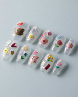 Squishy Pop short coffin nails with bright decals and cute tactile-looking gel accents
