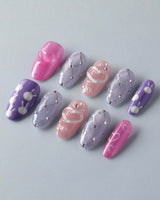 Charming Glam Usagi medium oval nails with glossy handmade finish and charming accents