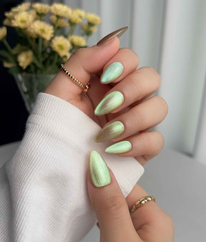 Aurora Mist handmade press-on nails featuring Champagne Nude, Green Aurora Cat Eye.