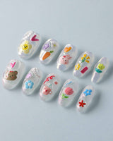 Squishy Pop medium oval press-ons with bubbly colorful nail art