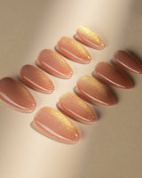 Aurora Flame nail art close-up showing orange & gold cat eye details