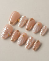 Venus handmade press-on nails featuring Pearly Nude, 3D Shells & Gold.
