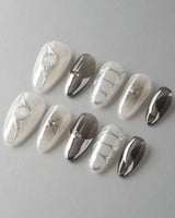 Silver Flame nail art close-up showing silver chrome metallic 3D sculpted nails details