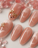 Thump Bunny medium oval press-on nails with peach heart cat-eye and bunny feature