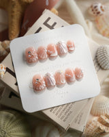 Glow Shore nude pink shell and pearl press-on nails by Joyee Nails