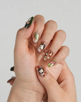 Autumn Tales short oval press-on nails with woodland mushroom art and 3D hedgehog accents