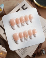 Cute French Tip Nails handmade press-on nails featuring french tip nails with pearls and teddy bear charm