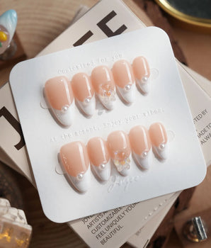 Cute French Tip Nails handmade press-on nails featuring french tip nails with pearls and teddy bear charm