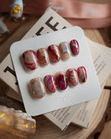 Baroque Palette press-on nails with marble mix design, pink red swirls and rose accents