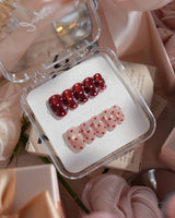 Heart Collector nail art close-up showing Vintage Red Pear, Contrasting Red & White Hearts, Cat-eye Shimmer details