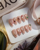 Mini Noel press-on nails — nude cat eye christmas icons handmade nail art by Joyee Nails